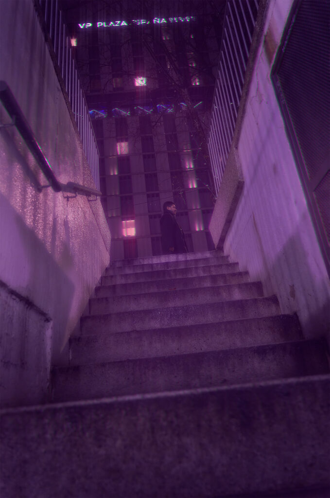 Lone figure at the top of concrete stairs at night in Madrid, VP Plaza España Design sign glowing above, purple atmospheric haze, cyberpunk street photography