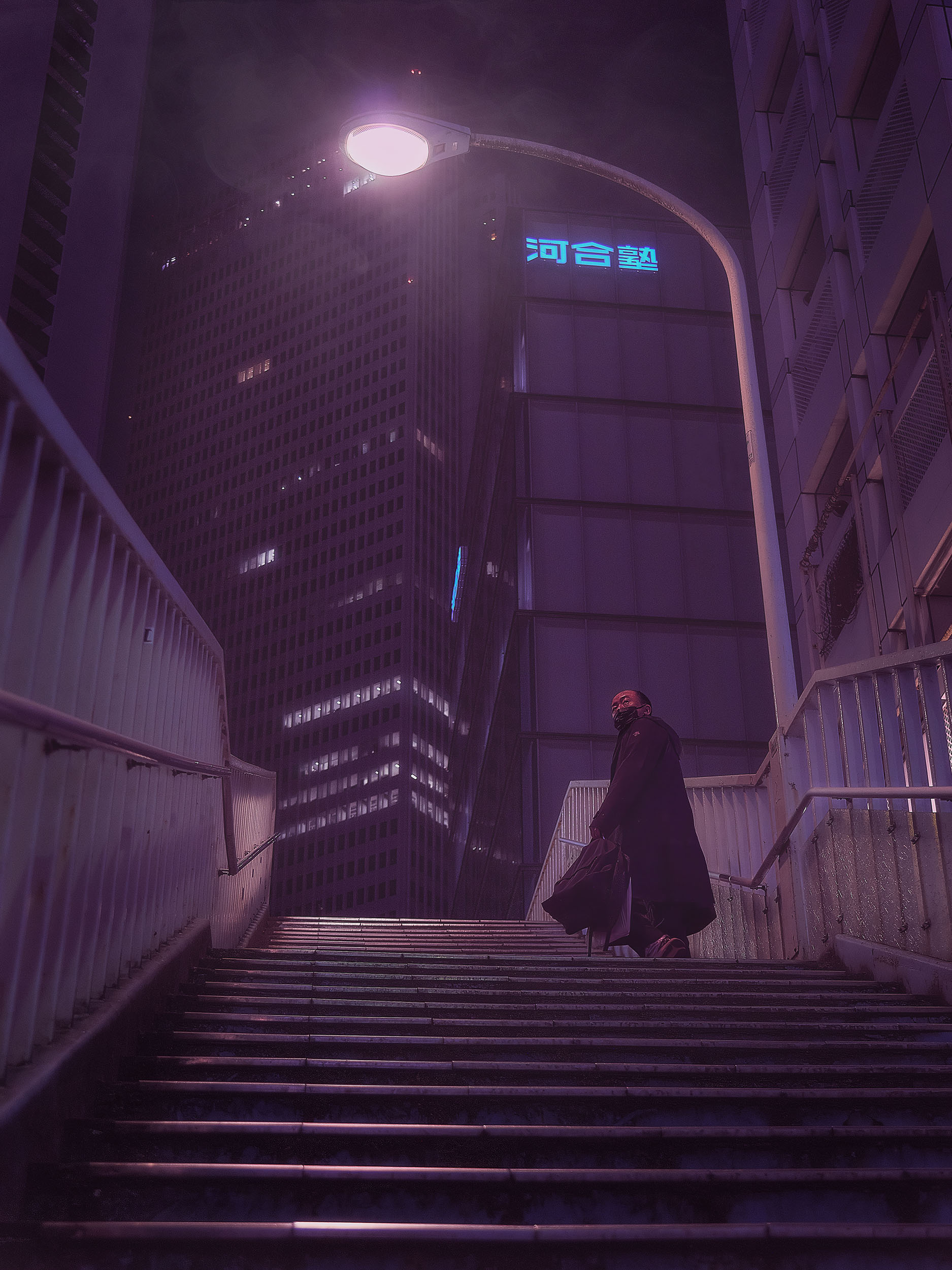 Lone figure on Tokyo stairs at night, towering skyscraper with neon Japanese sign in the background, purple atmospheric haze — cyberpunk street photography